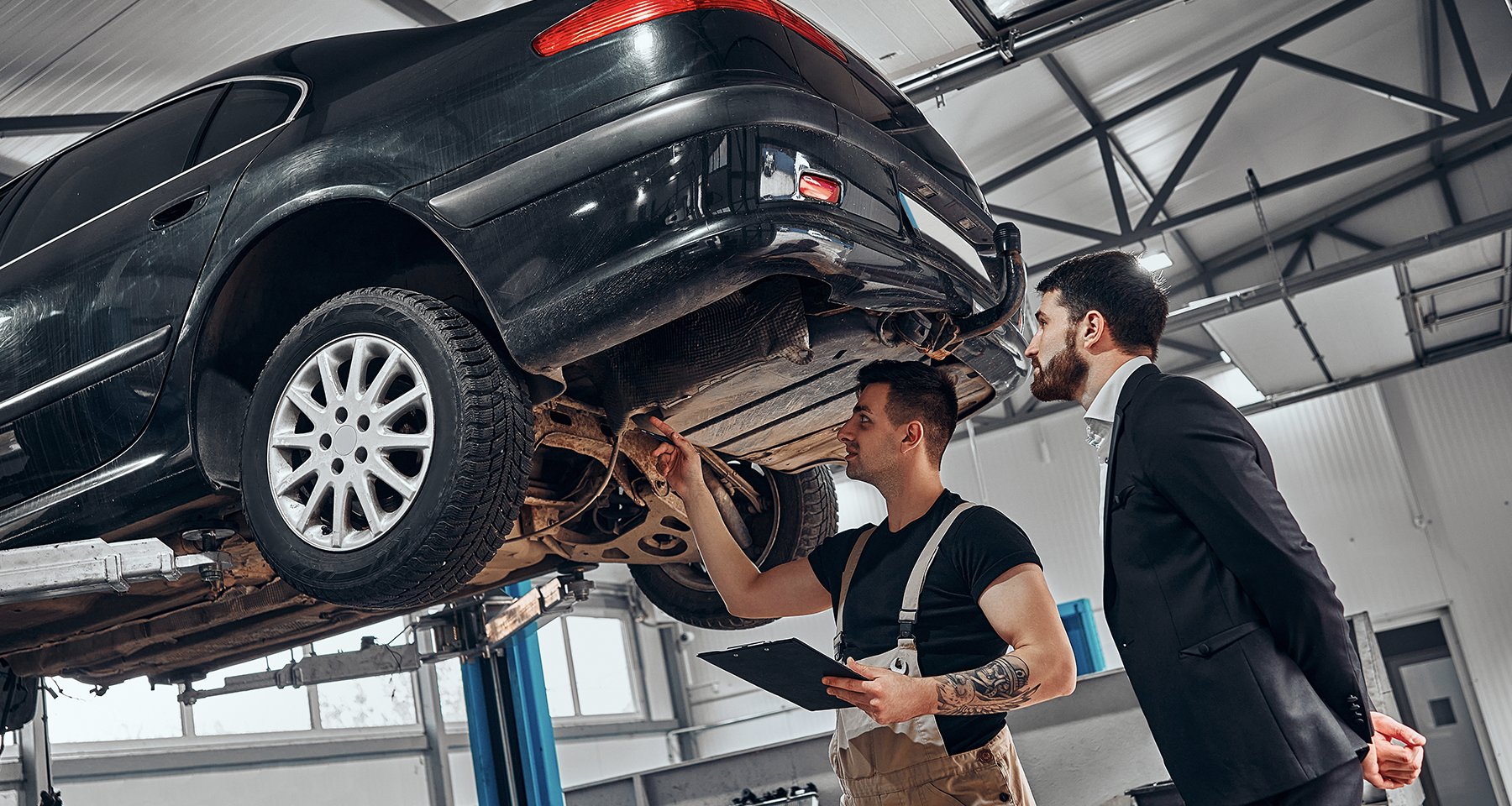 Professional automotive repair and detailing at Sahexee - master technician working on luxury vehicle restoration